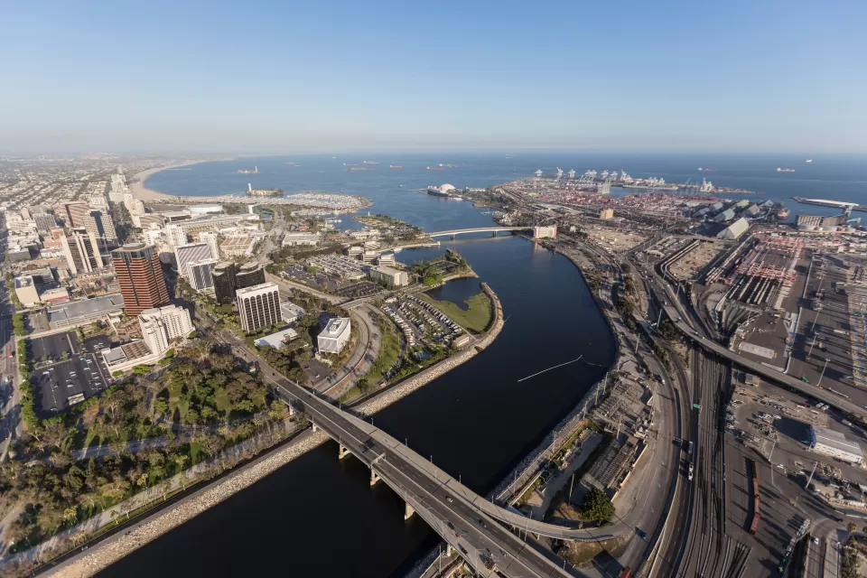 Aerial view of terminus of Los Angeles River and port infrastructure in Long Beach, California